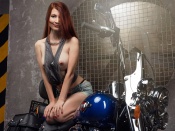 Topless redhead and Harley Davidson