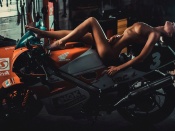 Nude blonde and Honda motorcycle