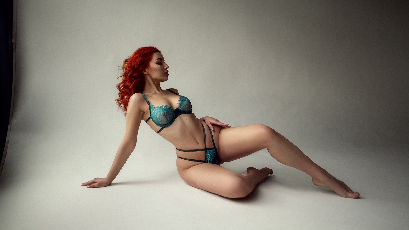 Curvy redhead in lingerie